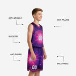Left side view of purple and hot-pink galaxy youth basketball uniform set showing continuous all-over sublimated print on jersey and shorts