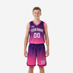 Custom purple youth basketball uniforms with pink gradient fade, V-neck jersey and matching shorts, honeycomb hex texture, front view
