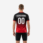 Close detail of red and black practice jersey gradient transition from jet black shoulder to red hem