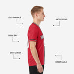 Custom red and black soccer jersey sleeve cuff detail showing matching three-stripe border trim on adult male model