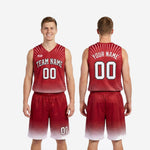 Back view of custom red and white basketball uniforms showing back number and player name placement on fully sublimated crimson jersey and shorts set