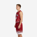 Front view of custom red and white basketball uniforms with arched team name in white lettering and sublimated starburst chest panel on adult male model