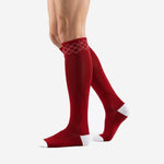 Custom red and white soccer socks angled view showing knee-high length and white heel cap