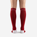 Close-up of the white argyle diamond cuff detail on custom red and white soccer socks