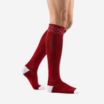 Custom red and white soccer socks side view showing dark red calf panel and white toe cap