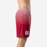 Side view of custom red basketball shorts showing hex-fade gradient from white waistband to solid crimson hem with side split detail