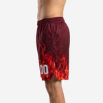 Opposite side view of custom red basketball shorts displaying continuous flame sublimation across the thigh panel and hem opening