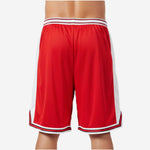Back view of custom red and black basketball shorts showing red body white side panels and sublimated stripe hem finish