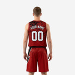 Back view of custom red and black basketball uniform set showing back number placement and bolt design continuing across the shorts