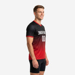 Left side view of red and black practice jersey showing gradient fade from black shoulder to red hem