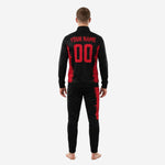 Close-up of the custom red and black soccer tracksuit jacket showing the stand collar, full-zip front, and red splash panel detail