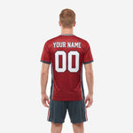 Custom red and black soccer kit back view showing player name and number print zones on crimson jersey with charcoal panels
