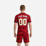 Custom red camo soccer jersey back view showing player surname and back number sublimated in white and athletic gold