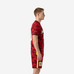 Custom red and black soccer uniforms mens side view showing neon yellow side stripe on jersey and shorts