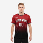 Custom red soccer shirt in dark red and black dot-burst gradient, front view on adult male model, team name and number printed across the chest