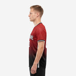 Custom red soccer shirt right side view displaying sublimated dark red and black gradient pattern with white contrast side panel