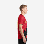Custom red soccer shirt with full-dye sublimated black flame design, left side view, short sleeve crew neck