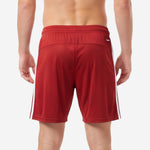 Custom red soccer shorts showing wide elastic waistband and clean exterior finish on adult male model