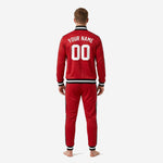 Custom red soccer tracksuit jacket chest detail showing sublimated black and white chevron panel with team logo and player number print zones