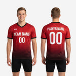 Collar and sleeve cuff detail of custom red soccer training jersey showing black V-neck trim and matching black cuff band