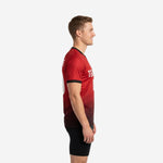 Left side view of custom red soccer training jersey with Crimson to Jet Black halftone dot-burst gradient and white side panel
