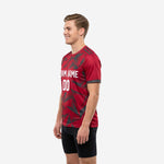 Custom red soccer training jersey right side view displaying athletic cut fit and Charcoal cuff trim on short sleeves