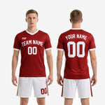Front and back view of custom red soccer uniform with team name and number on dark red jersey and white shorts
