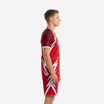 Custom red soccer uniform kit left side view showing dark red raglan sleeves and white sublimated bolt panel design