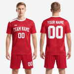 Close detail of red soccer uniform shorts showing white side panel stripe and player number on lower left leg