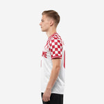 Custom red and white soccer jersey alternate side view displaying back number and checkered short sleeve detail on male model