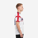 Custom red and white soccer jersey showing scarlet red cross panel design from left side on men's short sleeve kit