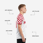Close-up of red ribbed crew neckline and sleeve cuff trim on custom red and white checkerboard soccer jersey