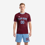 Men's custom retro soccer uniforms in maroon jersey and powder blue shorts, front view with team name and number sublimated on chest