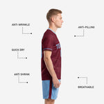 Close detail of powder blue custom soccer shorts with maroon side stripe and sublimated player number on left leg