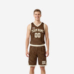 Custom reversible basketball uniform sets in brown with cream topographic contour lines, V-neck jersey and matching shorts, front view