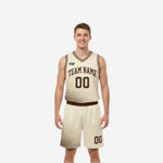 Custom reversible basketball uniform sets showing cream reverse side with brown halftone dot fade, brown arched team name and front number, adult male model front view