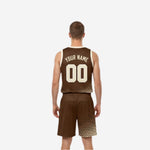 Custom brown and cream reversible basketball uniform side view showing halftone dot pattern on jersey side panel and shorts leg