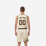 Custom cream and brown reversible basketball uniform side view showing reverse side panel detail and shorts side halftone dots