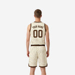 Cream reverse side view of reversible basketball uniform set with brown topographic design and brown armhole binding detail