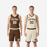 Full two-sided reversible basketball uniform set laid flat showing both the brown side and the cream side with topographic design