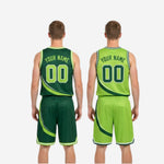 Full set view of the custom green and white reversible basketball uniforms showing jersey and shorts laid flat front and back
