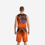Orange side reversible basketball uniform side view showing V-neck binding and shorts leg graphic