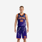 Custom reversible team basketball uniforms in purple with orange trim and white lightning bolt graphic, full set front view on male model