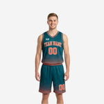 Custom reversible team basketball uniforms in teal with orange halftone dot pattern, arched team name and number 00 on front, matching shorts
