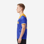 Custom Royal Blue and Athletic Gold soccer jerseys with shorts colorway shown from right side angle on male model