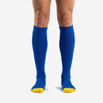 Custom royal blue soccer socks with gold toe and heel contrast shown from the front on adult male model