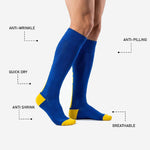 Custom royal blue soccer socks gold heel cup and toe box contrast detail on adult male model