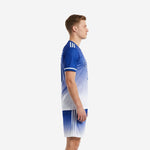 Side view of custom Royal Blue gradient soccer kit showing white stripe accents on jersey sleeve and shorts