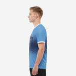 Men's custom royal blue soccer jersey showing navy blue halftone dot pattern on sky blue base, right side view