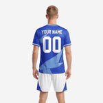Close detail of Royal Blue soccer jersey with white and Sky Blue origami geometric design and team name customization